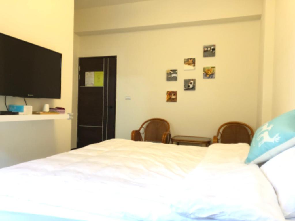 Postel nebo postele na pokoji v ubytování Elk Kitten Homestay