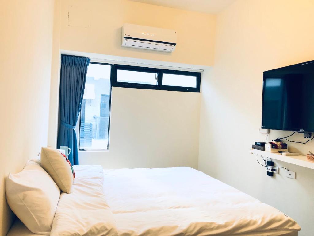 Postel nebo postele na pokoji v ubytování Elk Kitten Homestay