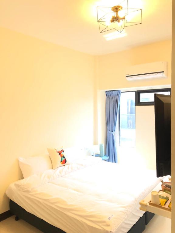Postel nebo postele na pokoji v ubytování Elk Kitten Homestay