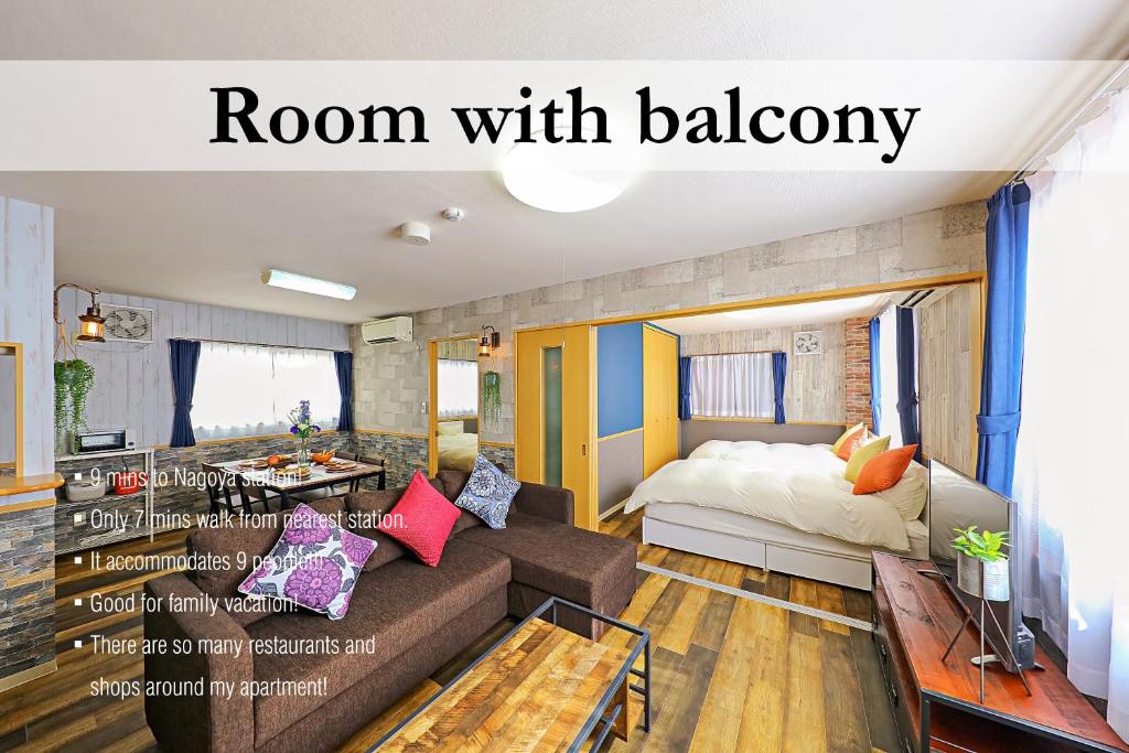 een kamer met een bed en een kamer met een bank bij Prosper 6th bldg in Nagoya