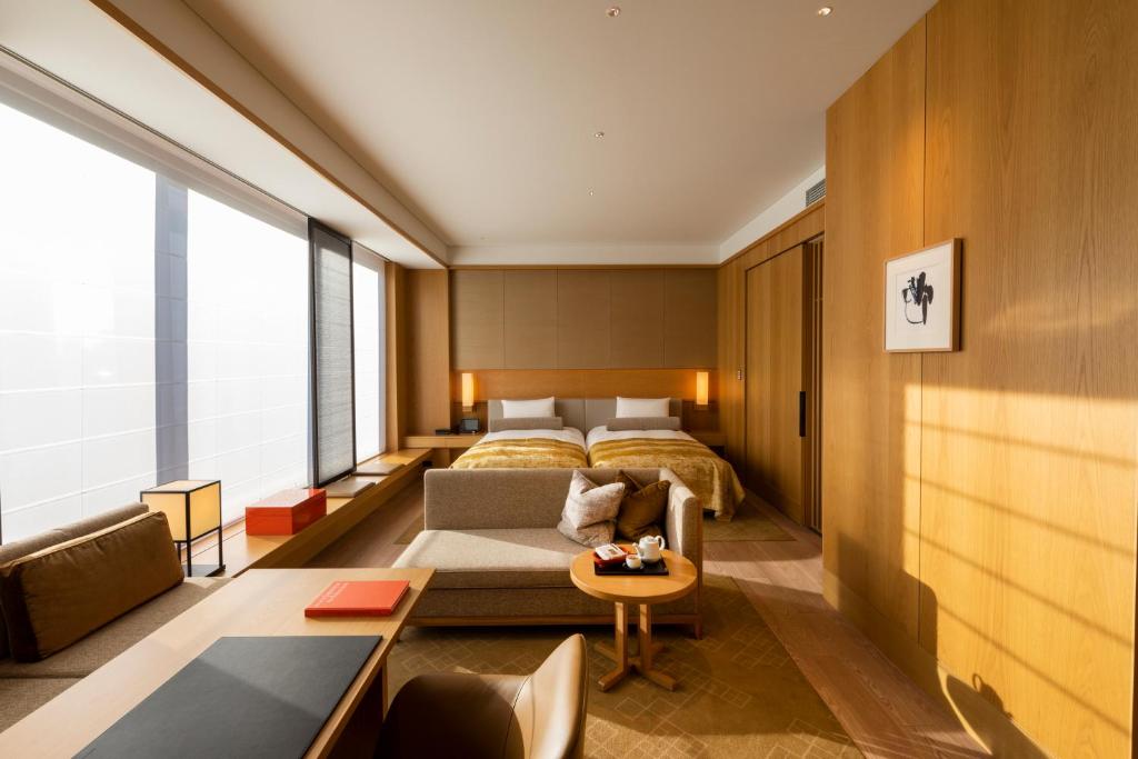 Postel nebo postele na pokoji v ubytování The Okura Tokyo