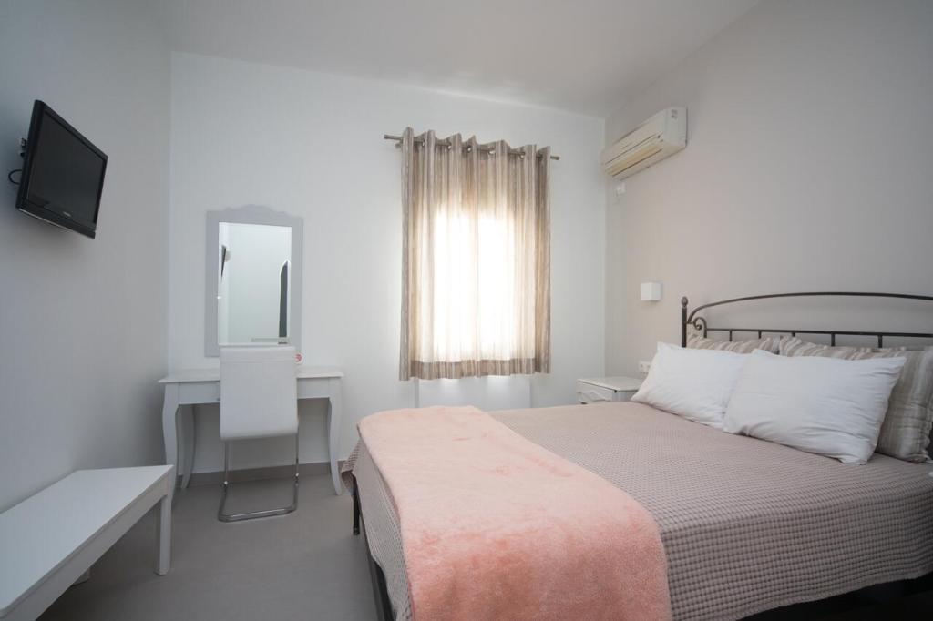 Postel nebo postele na pokoji v ubytování Pelican Hotel