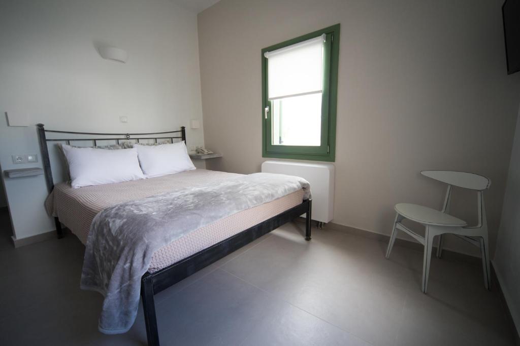 Postel nebo postele na pokoji v ubytování Pelican Hotel