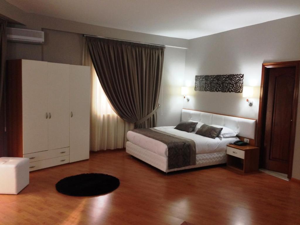 Postel nebo postele na pokoji v ubytování Hotel Arvi