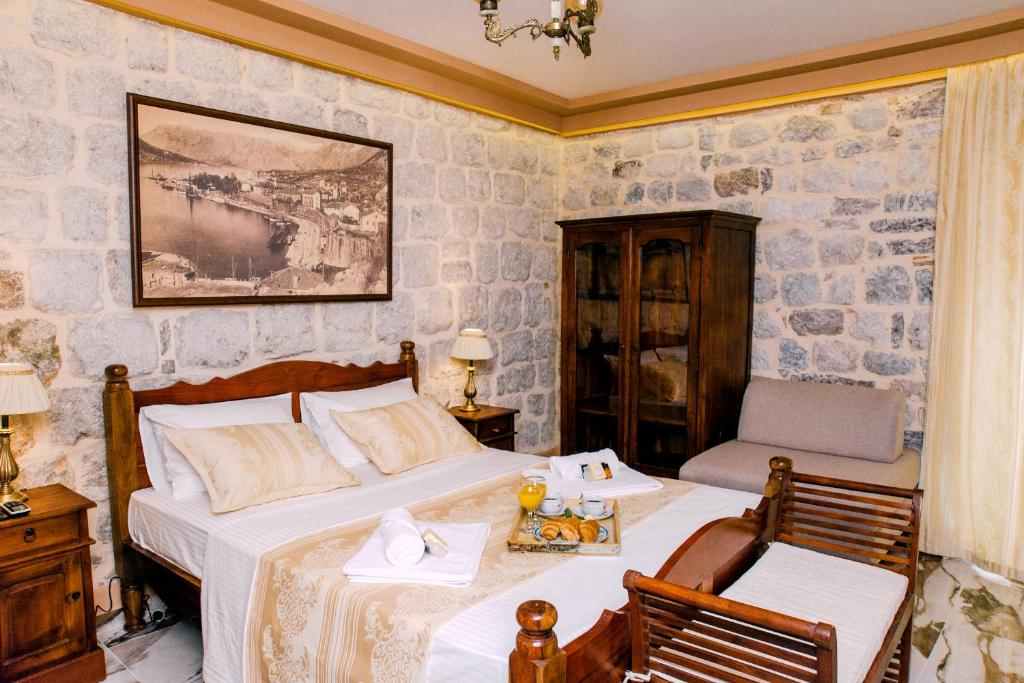 Postel nebo postele na pokoji v ubytování D & Sons Apartments