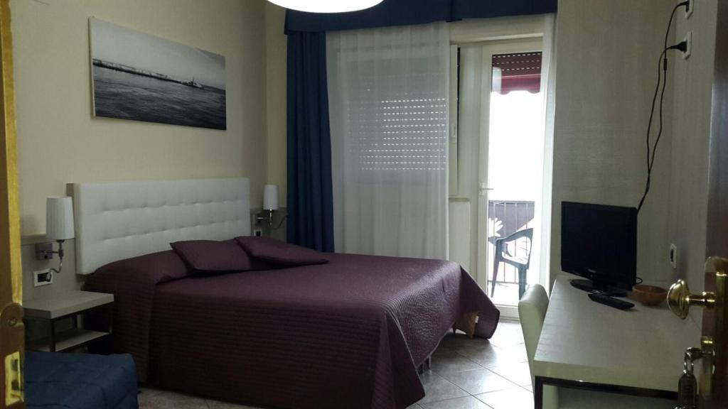 Postel nebo postele na pokoji v ubytování Hotel Bella Riviera Lungomare