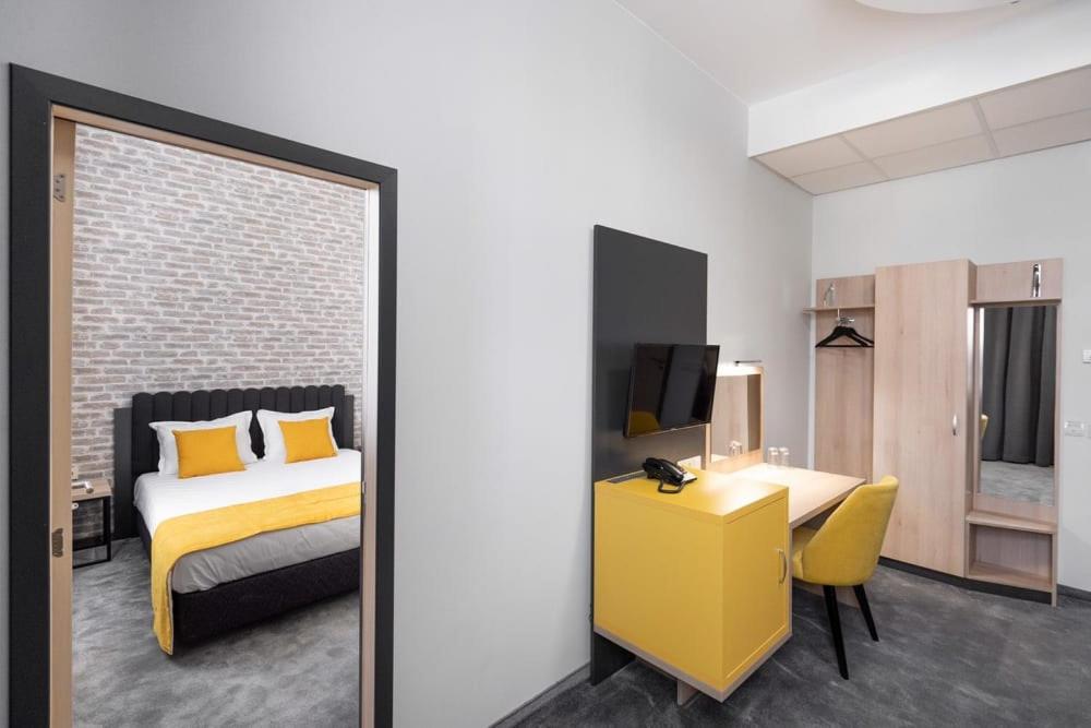 Postel nebo postele na pokoji v ubytování ADEO HOTEL Sport & SPA