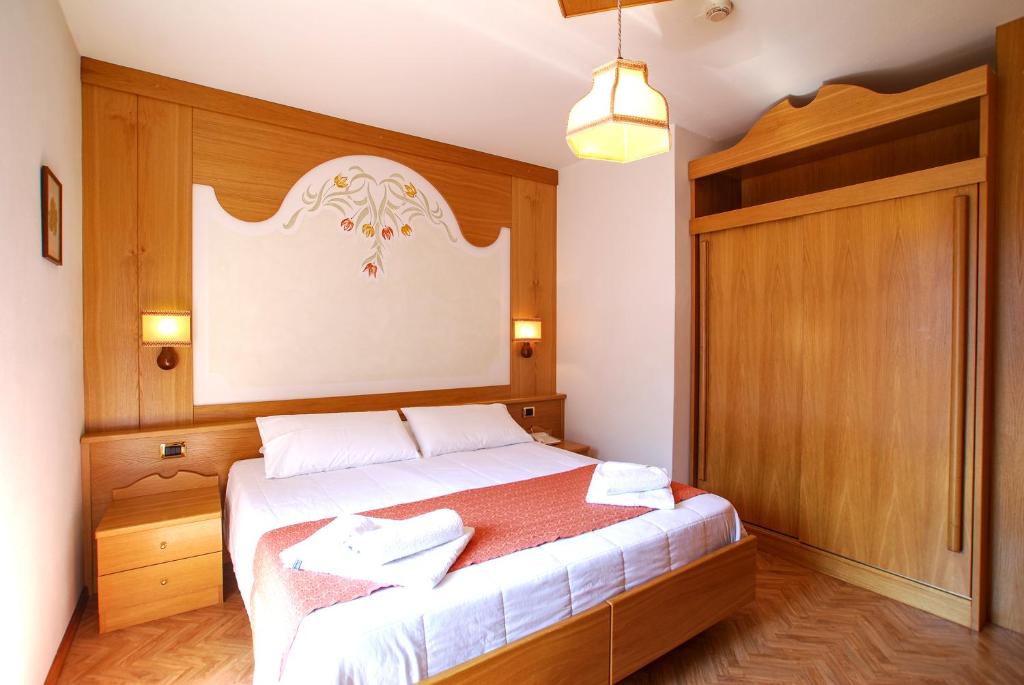 Postel nebo postele na pokoji v ubytování Charme Hotel Nevada