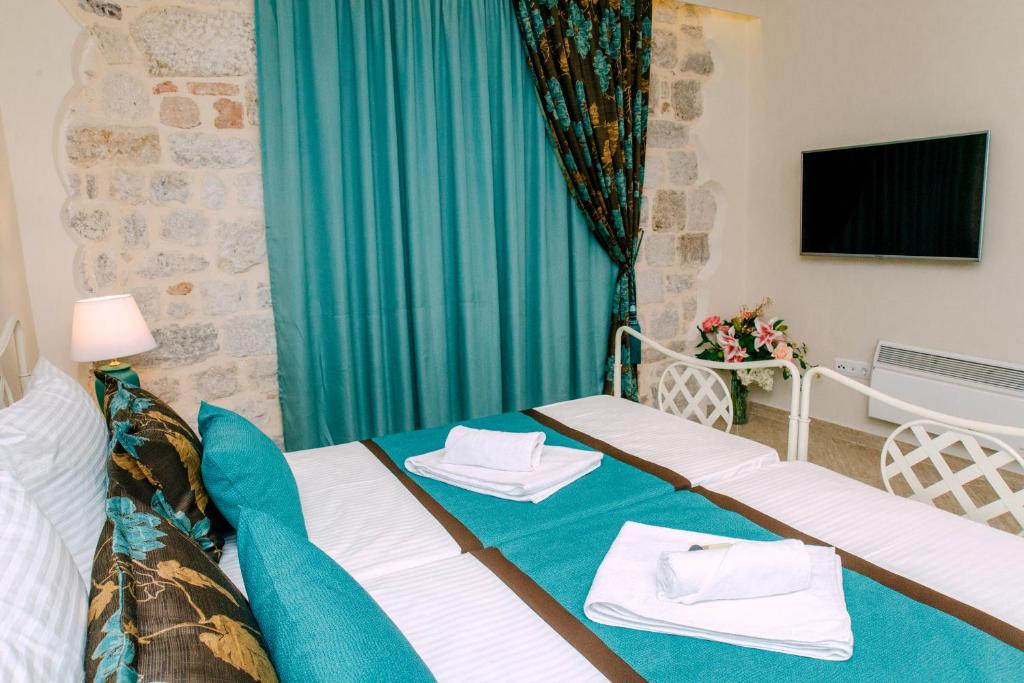 Postel nebo postele na pokoji v ubytování D & Sons Apartments