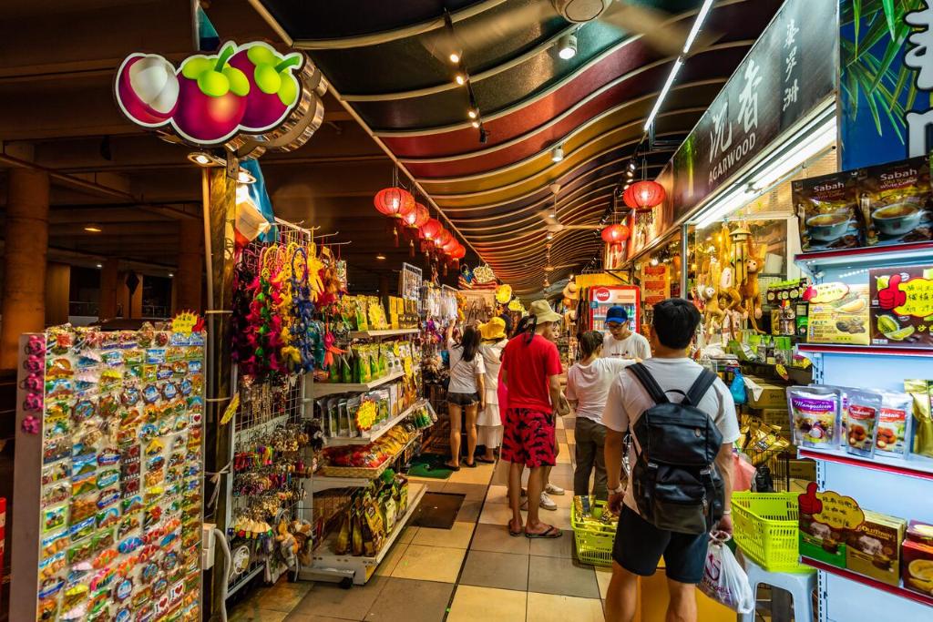 a group of people standing inside of a store at AC Residence - Behind Cititel Hotel in Kota Kinabalu