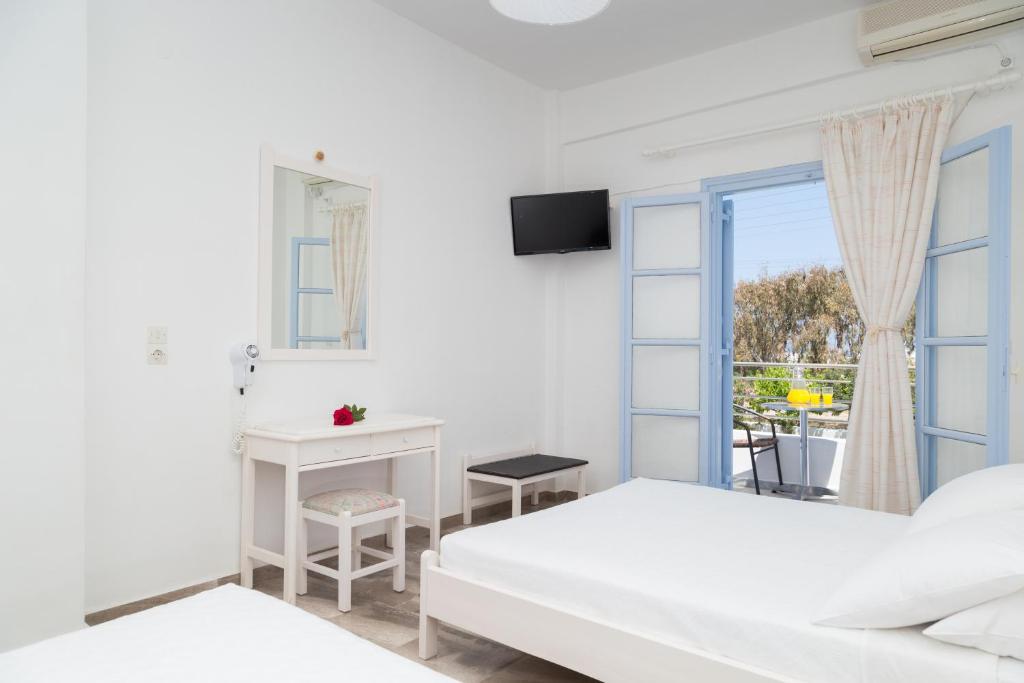 Postel nebo postele na pokoji v ubytování Areti Hotel