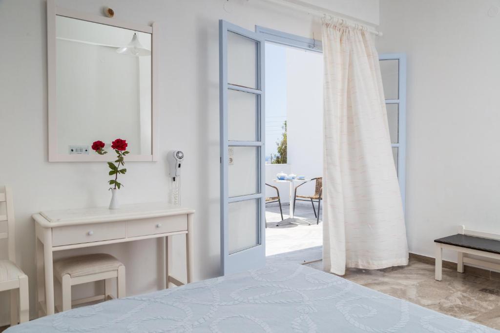 Postel nebo postele na pokoji v ubytování Areti Hotel