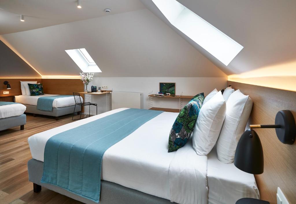 Postel nebo postele na pokoji v ubytování Hygge Hotel
