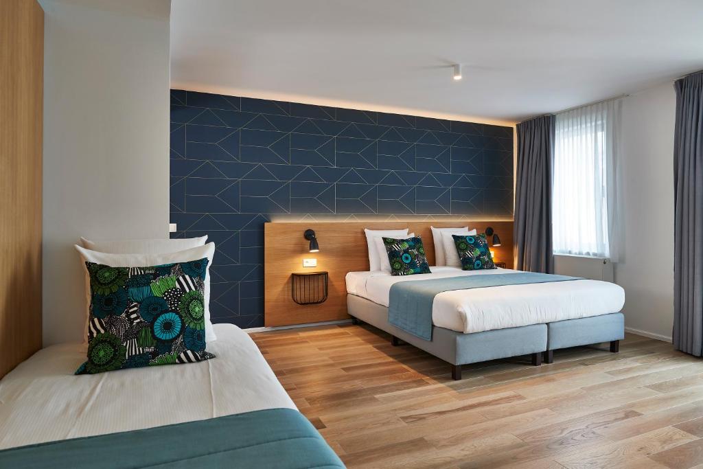 Postel nebo postele na pokoji v ubytování Hygge Hotel