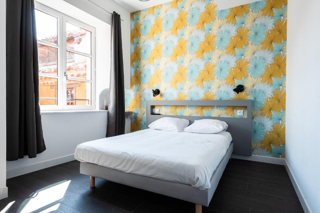 Postel nebo postele na pokoji v ubytování Le Couvent - Hostel