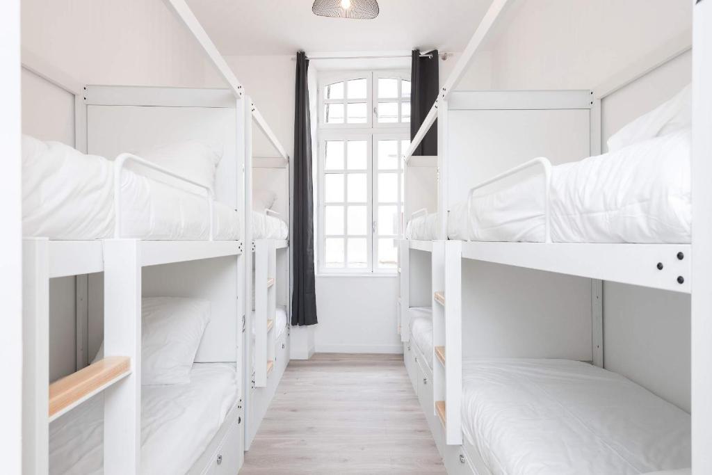 Postel nebo postele na pokoji v ubytování Le Couvent - Hostel