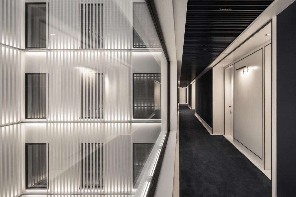 a hallway of a building with white walls and windows at Seventy Barcelona in Barcelona