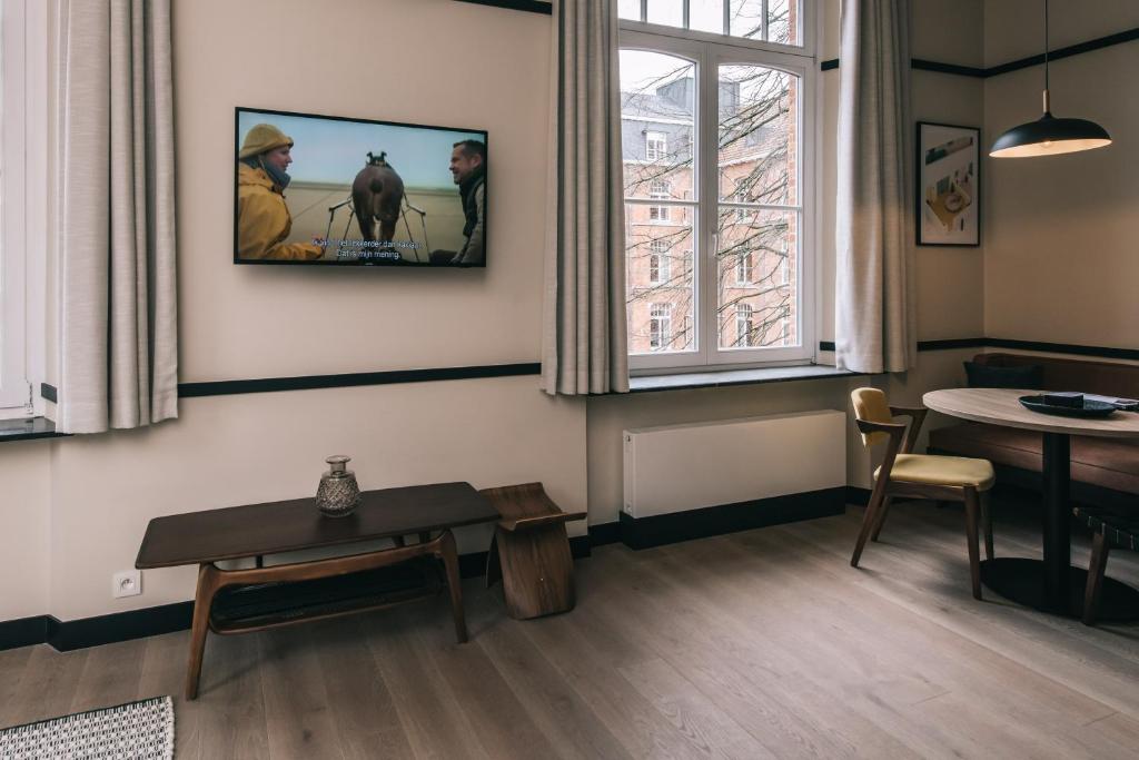 TV a/nebo společenská místnost v ubytování Getaway Studios Gent