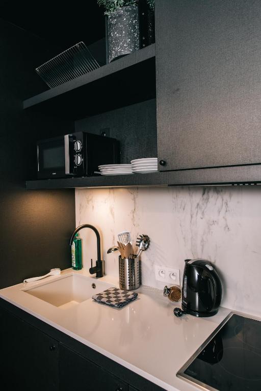 Kuchyň nebo kuchyňský kout v ubytování Getaway Studios Gent
