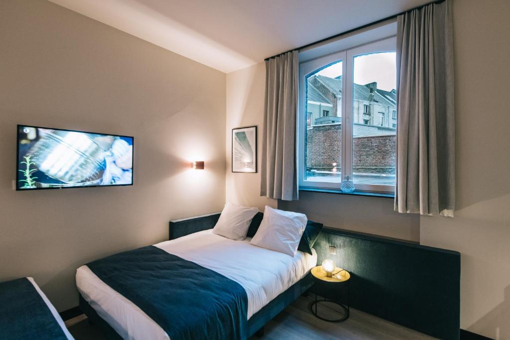 Postel nebo postele na pokoji v ubytování Getaway Studios Gent