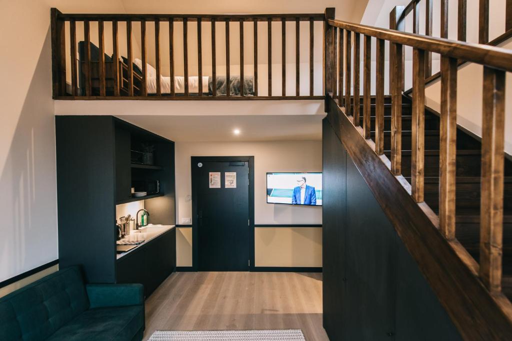 TV a/nebo společenská místnost v ubytování Getaway Studios Gent