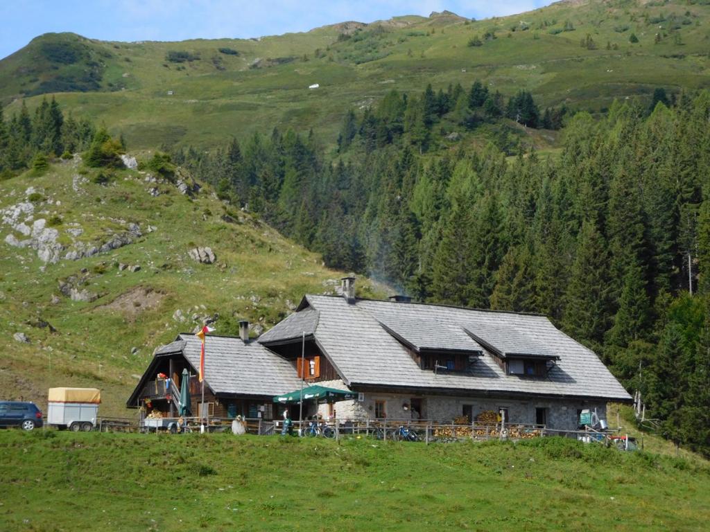 a large house on a hill in the mountains at Straniger Alm in Stranig