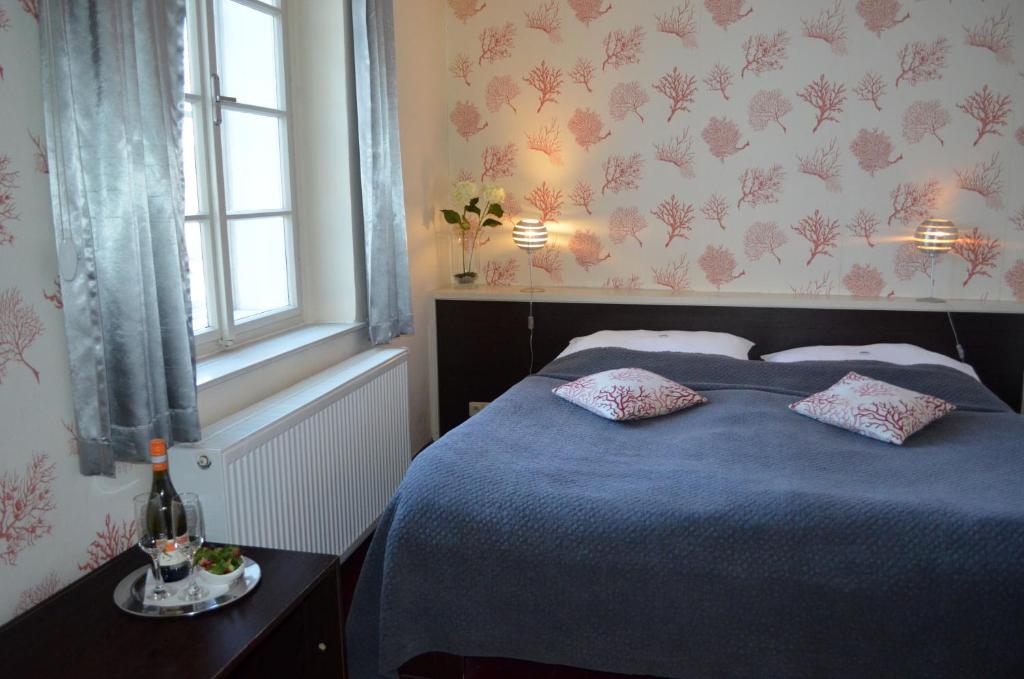 Postel nebo postele na pokoji v ubytování Hotel Peregrin