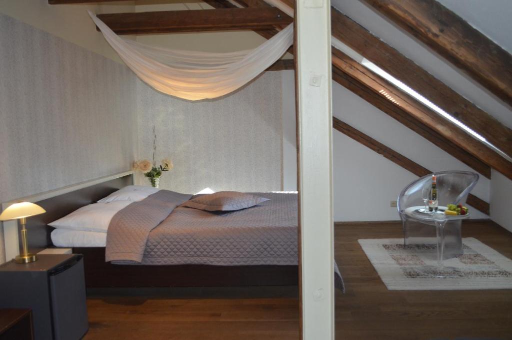 Postel nebo postele na pokoji v ubytování Hotel Peregrin