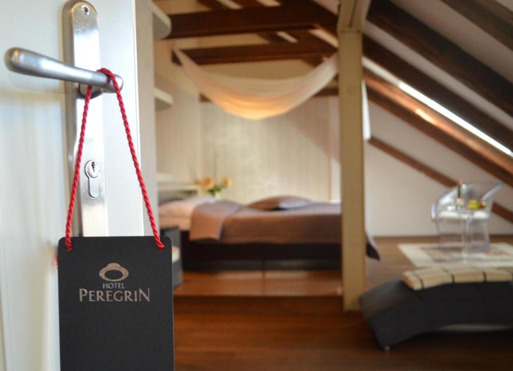 Postel nebo postele na pokoji v ubytování Hotel Peregrin