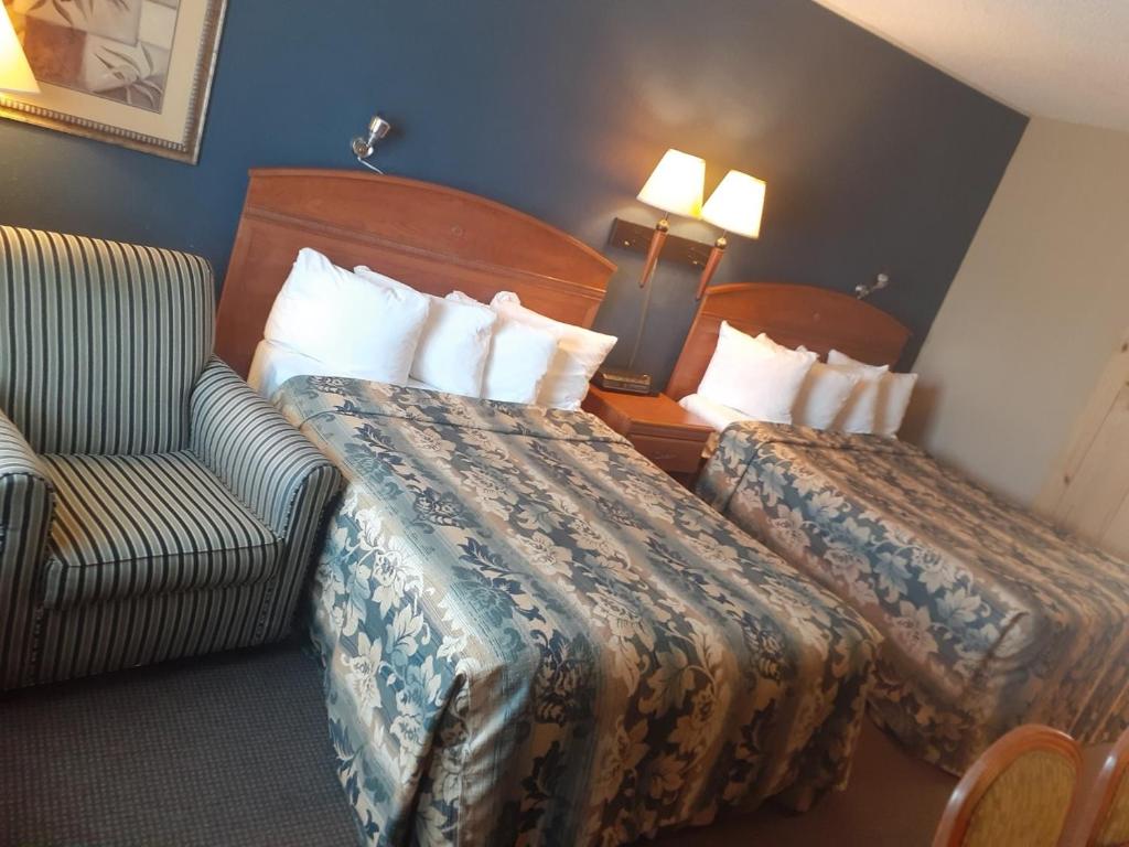 Ένα ή περισσότερα κρεβάτια σε δωμάτιο στο Rochester Inn