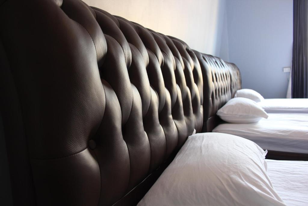 Postel nebo postele na pokoji v ubytování Backpackers Imperial Hotel
