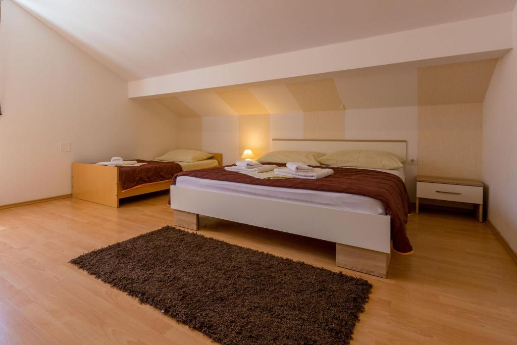 Posteľ alebo postele v izbe v ubytovaní Apartment LINDA