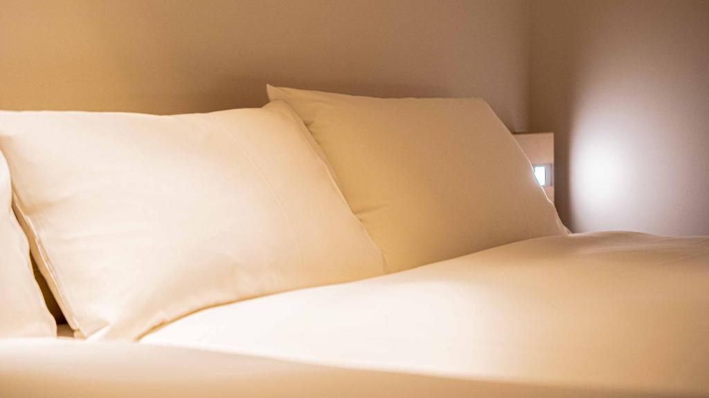 Postel nebo postele na pokoji v ubytování GEN HOTEL KAMAKURA