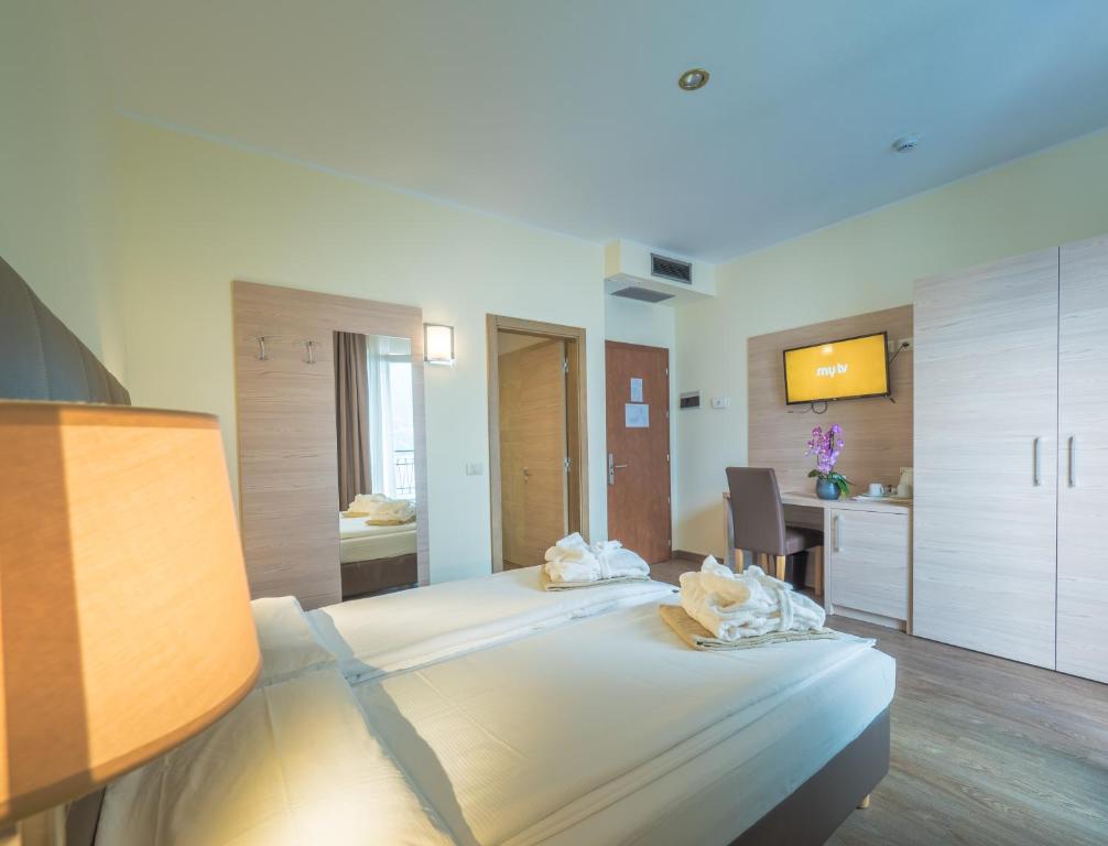Postel nebo postele na pokoji v ubytování Hotel Capo Reamol
