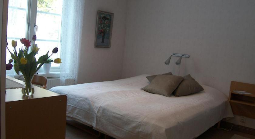 Postel nebo postele na pokoji v ubytování Svanstein Lodge