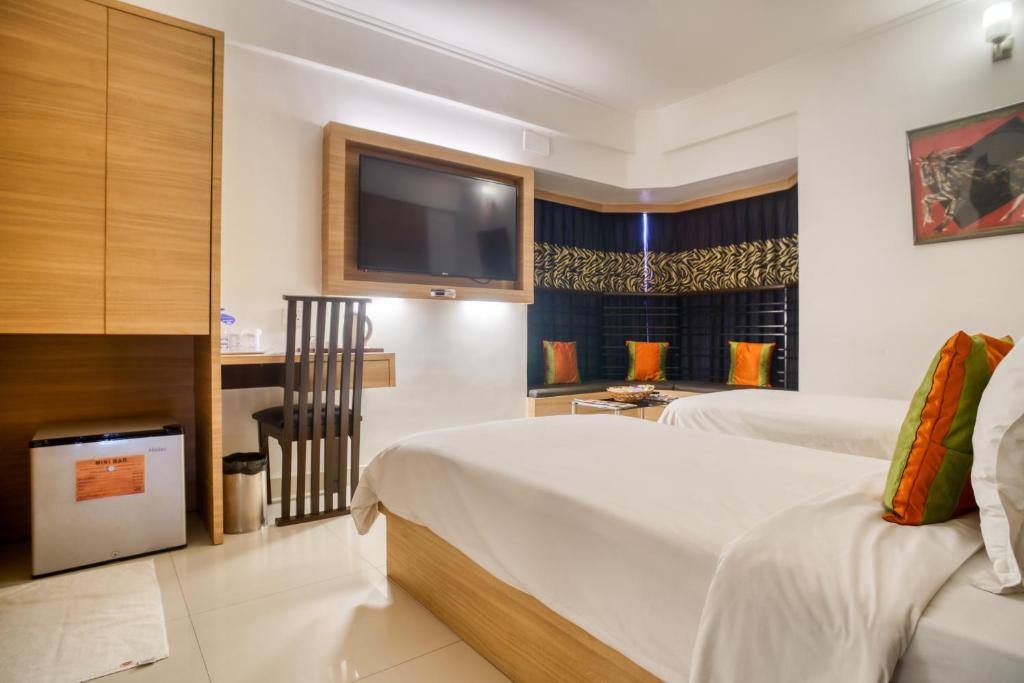 Postel nebo postele na pokoji v ubytování Roland Hotel