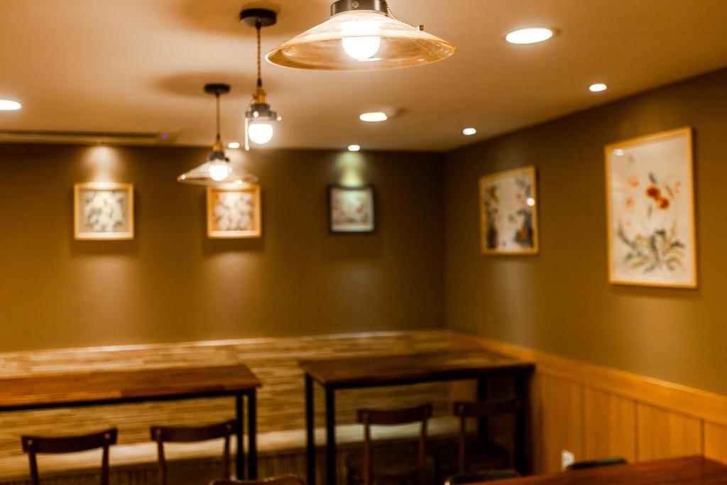 a dining room with a table and chairs in it at Step Inn Myeongdong 1 in Seoul