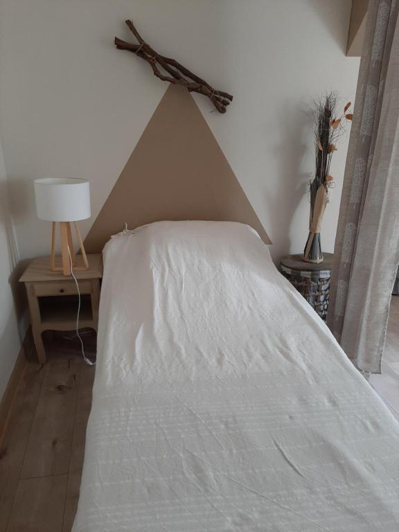 Postel nebo postele na pokoji v ubytování Moulin de Latouille