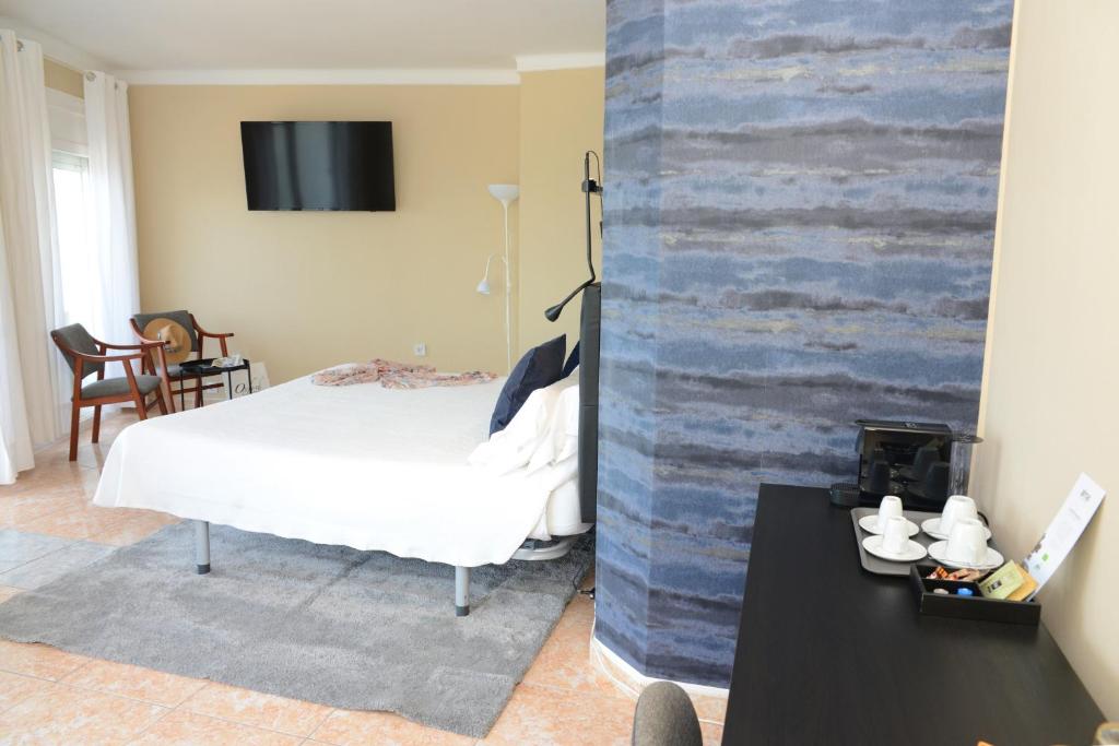 Postel nebo postele na pokoji v ubytování Rallye Hotel