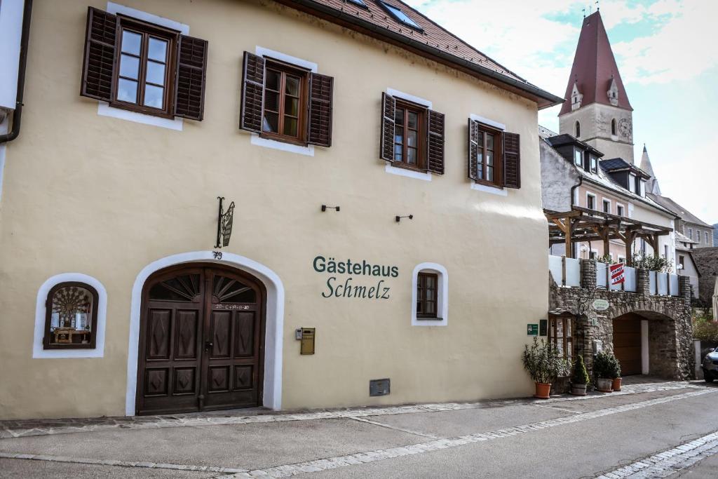 
a building with a sign on the front of it at Gästehaus Schmelz in Weissenkirchen in der Wachau
