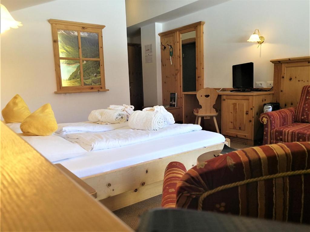 Postel nebo postele na pokoji v ubytování Hotel Vernagt