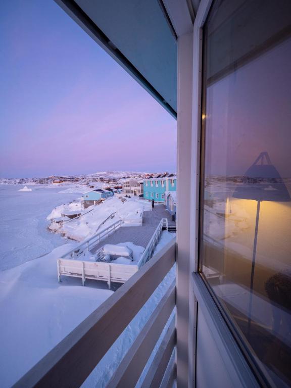 a view of the ocean from a balcony of a building at Hotel Icefiord in Ilulissat