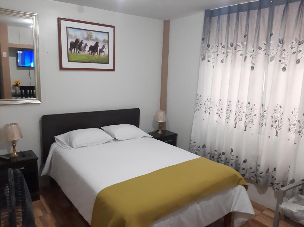 Postel nebo postele na pokoji v ubytování Apartments & Rooms Helena