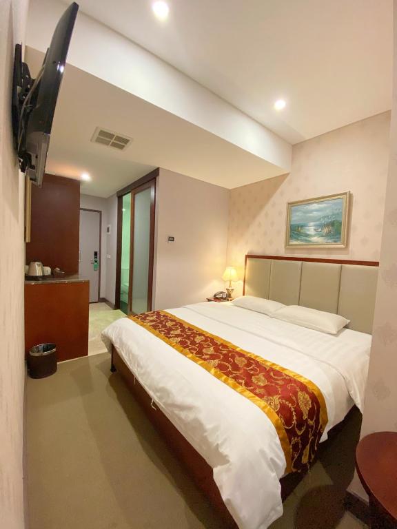 Postel nebo postele na pokoji v ubytování Megaboom City Hotel
