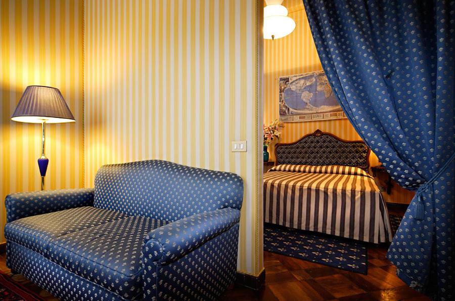 Postel nebo postele na pokoji v ubytování Centauro Hotel