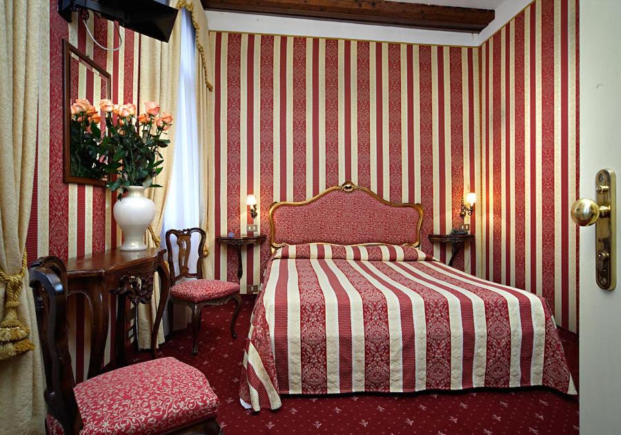 Postel nebo postele na pokoji v ubytování Centauro Hotel