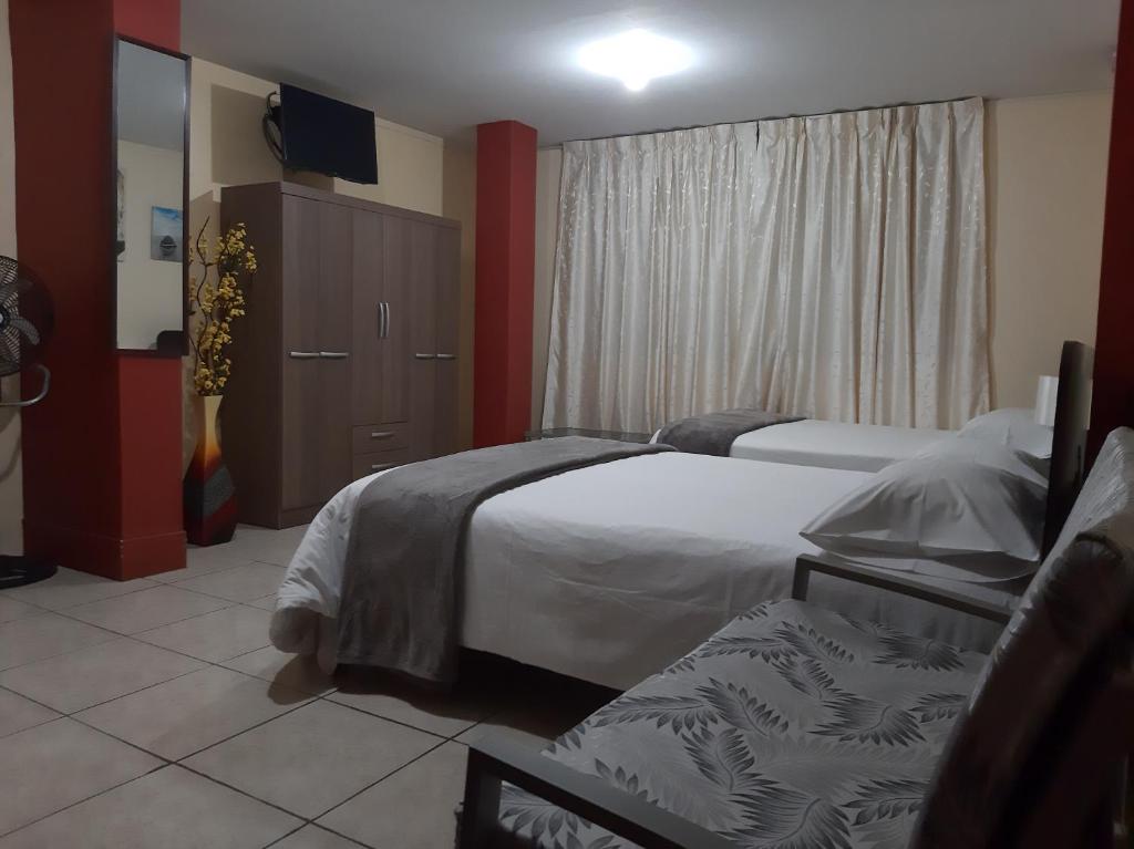 Postel nebo postele na pokoji v ubytování Apartments & Rooms Helena
