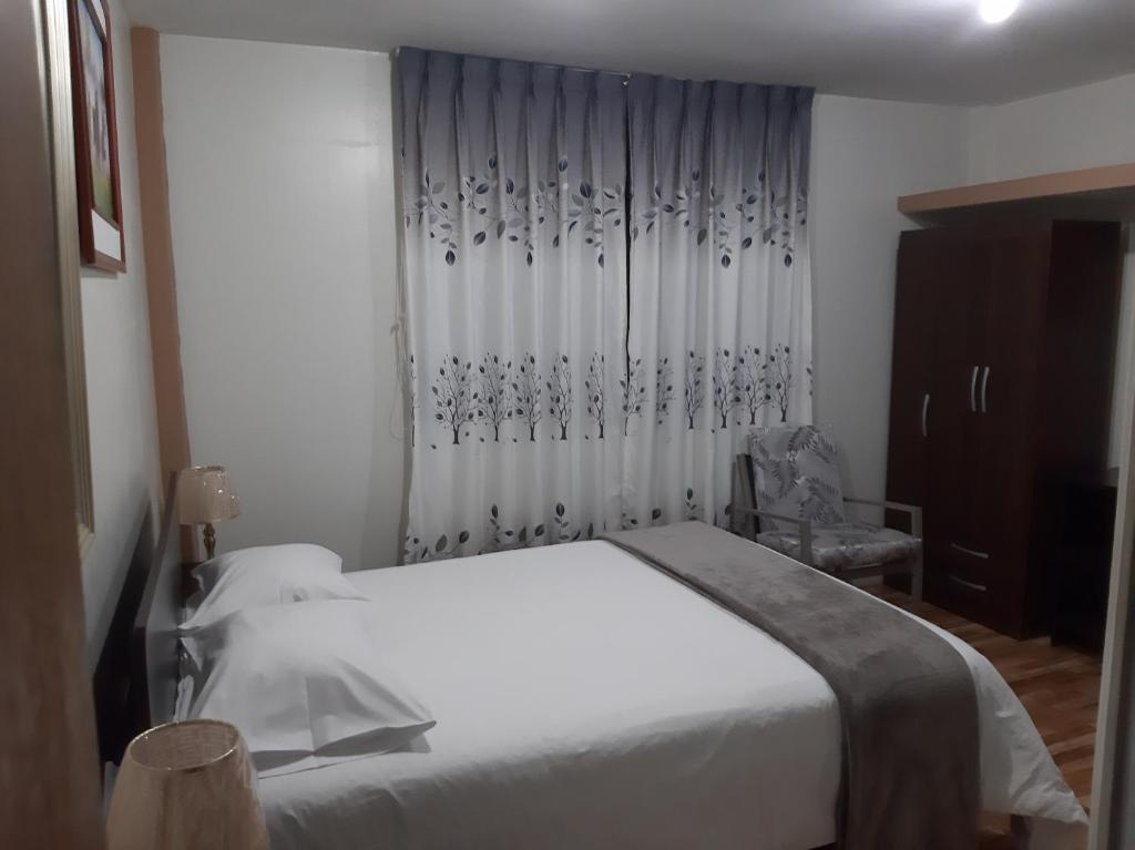 Postel nebo postele na pokoji v ubytování Apartments & Rooms Helena