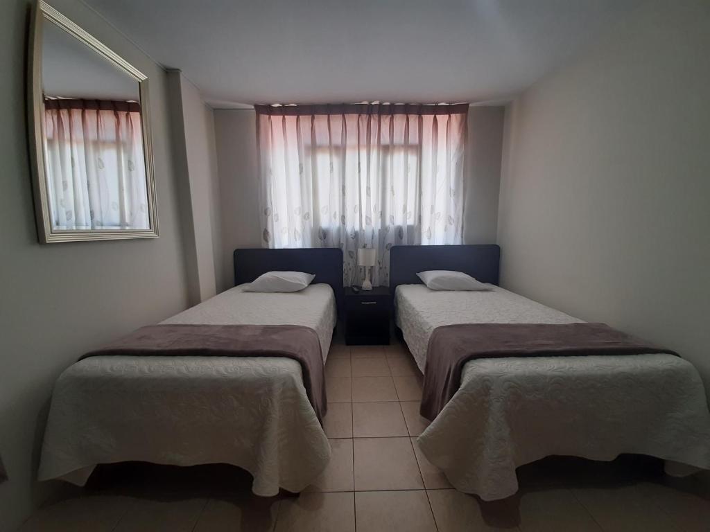 Postel nebo postele na pokoji v ubytování Apartments & Rooms Helena