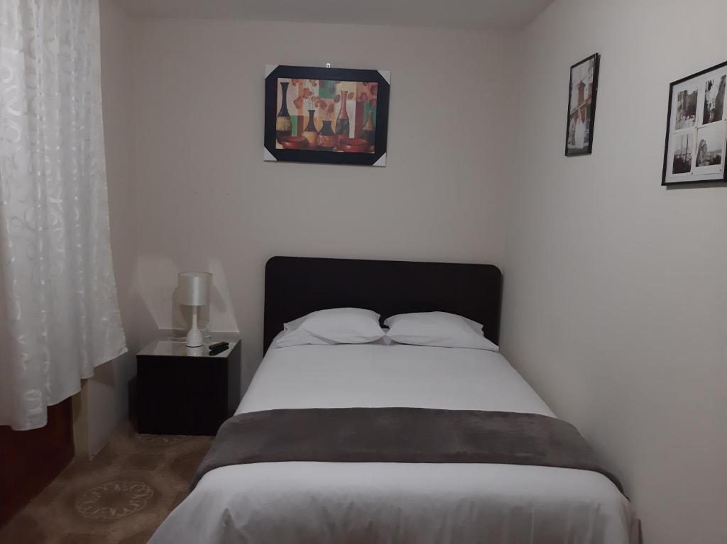 Postel nebo postele na pokoji v ubytování Apartments & Rooms Helena